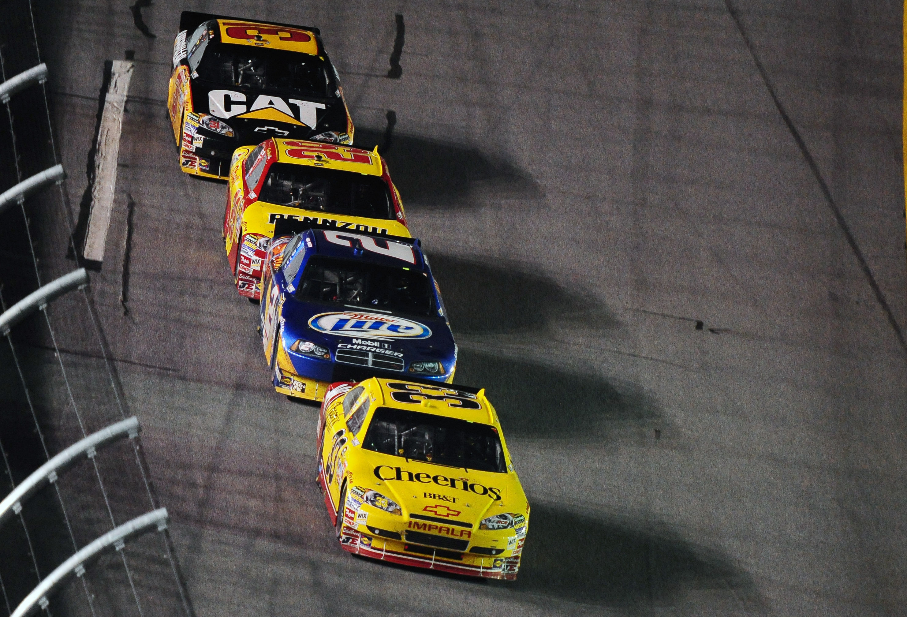 Clint Bowyer (33) leads Kurt Busch (2), Kevin Harvick (29), and Jeff Burton (31) during the 2010 Coke Zero 400. Source: Imagn